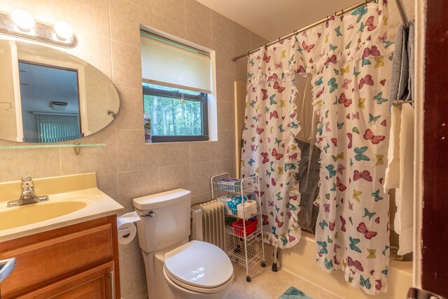 88 Wild Turkey Cir, Lake Ariel, PA 18436 - bathroom with tile walls, shower / bath combo, vanity, radiator, and tile patterned floors