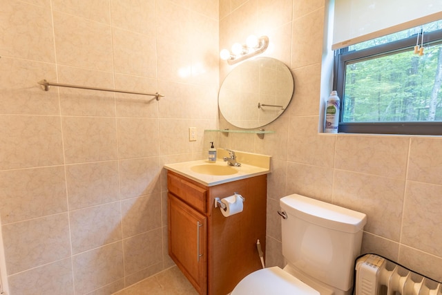 88 Wild Turkey Cir, Lake Ariel, PA 18436 - bathroom with tile walls, vanity, and radiator heating unit