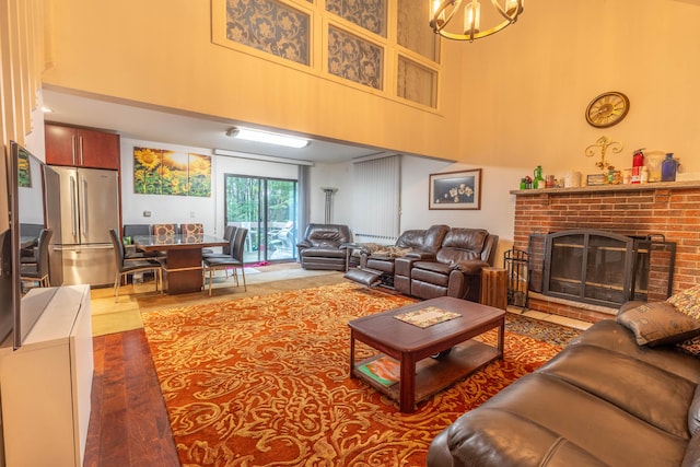 88 Wild Turkey Cir, Lake Ariel, PA 18436 - living area with a high ceiling, a fireplace, and a chandelier