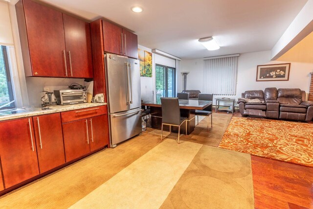 88 Wild Turkey Cir, Lake Ariel, PA 18436 - kitchen featuring high end refrigerator, open floor plan, light wood-style floors, recessed lighting, and dark brown cabinets