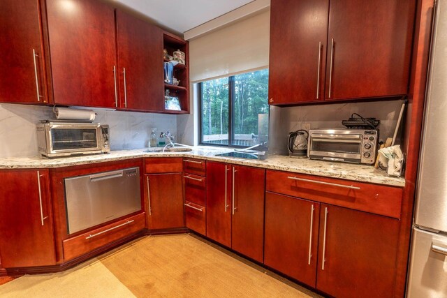 88 Wild Turkey Cir, Lake Ariel, PA 18436 - kitchen with appliances with stainless steel finishes, backsplash, open shelves, and light stone counters