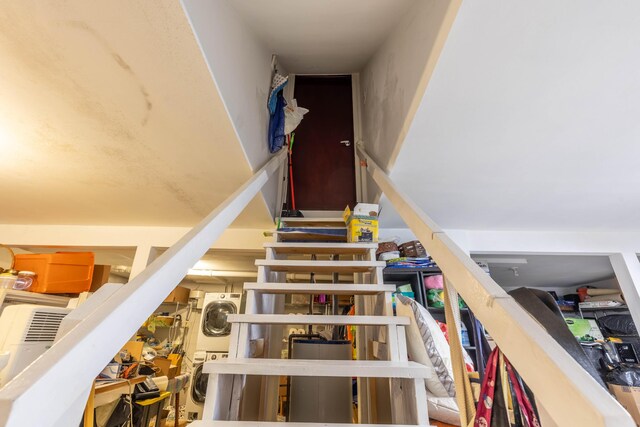 88 Wild Turkey Cir, Lake Ariel, PA 18436 - staircase featuring stacked washing machine and dryer and water heater