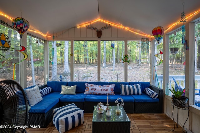 sunroom / solarium with vaulted ceiling