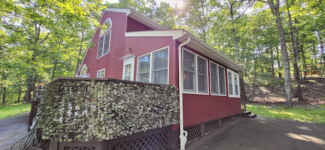 210 Dover Dr, Bushkill, PA 18324 - view of home's exterior featuring a sunroom