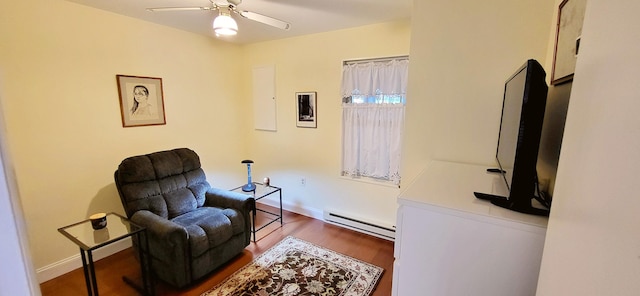 210 Dover Dr, Bushkill, PA 18324 - sitting room with a baseboard radiator, wood finished floors, and a ceiling fan