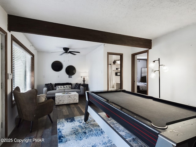 recreation room with dark hardwood / wood-style floors, pool table, a textured ceiling, and beam ceiling