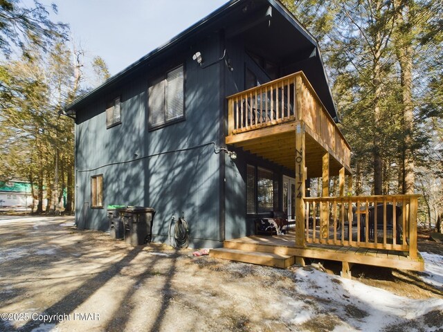 view of side of property with a deck