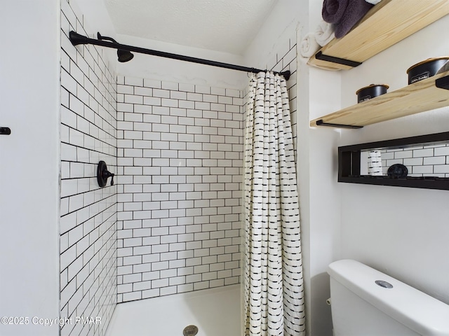 bathroom with toilet and a shower with shower curtain