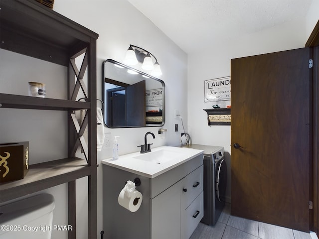 bathroom featuring vanity, toilet, and tile patterned flooring