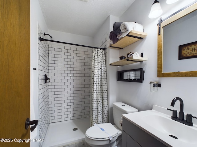 bathroom with walk in shower, vanity, toilet, and a textured ceiling