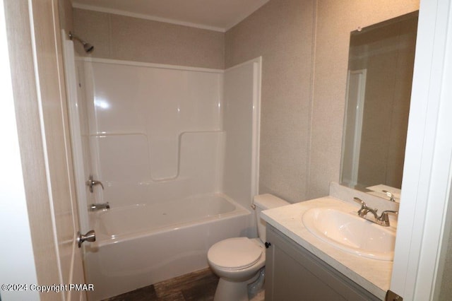 bathroom featuring shower / bath combination, vanity, and toilet