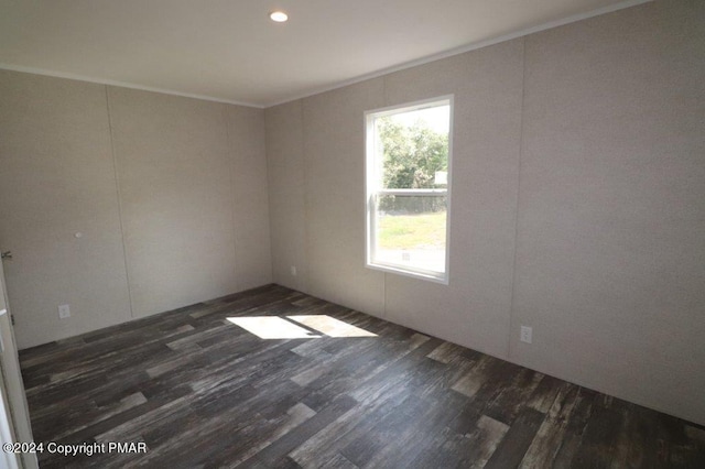 unfurnished room featuring ornamental molding, wood finished floors, and recessed lighting