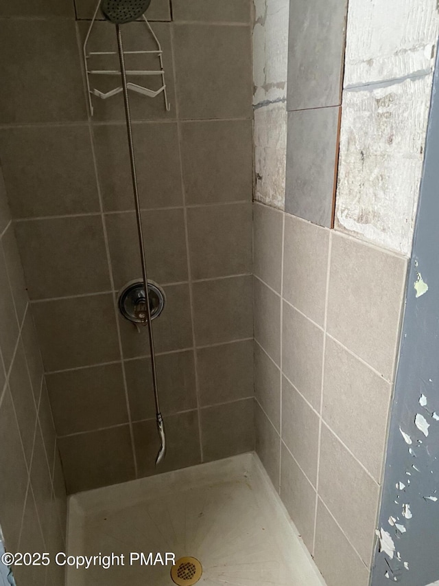 bathroom with tiled shower