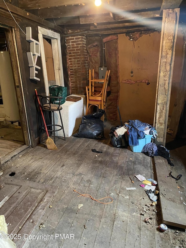 interior space featuring gas water heater and wood-type flooring