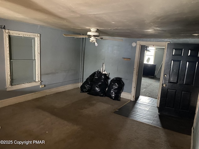 foyer entrance with ceiling fan