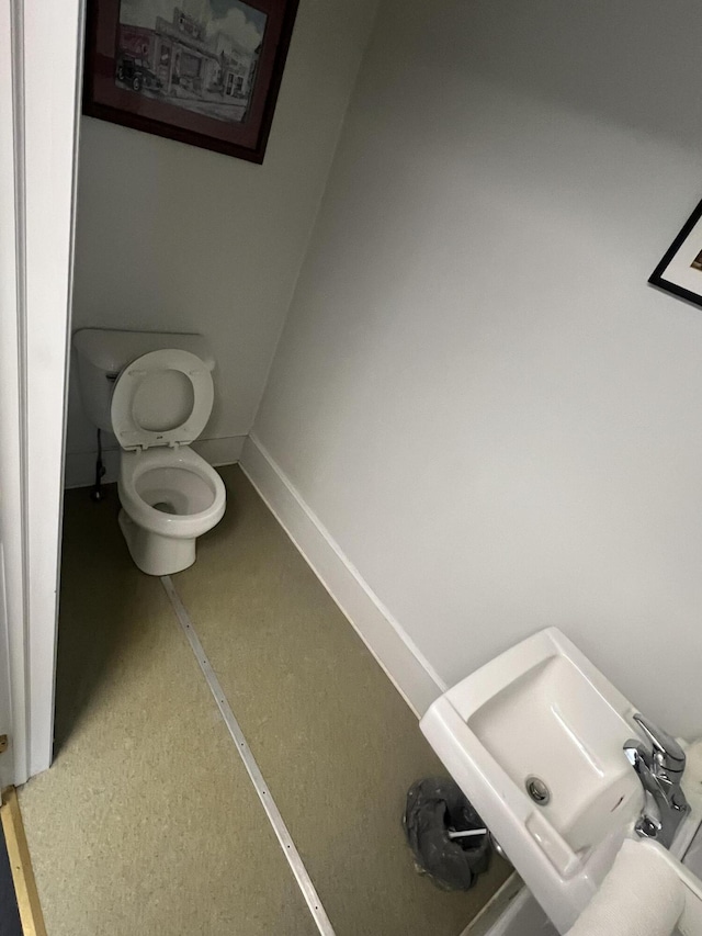 233 W Broad St, Tamaqua, PA 18252 - bathroom featuring toilet and baseboards