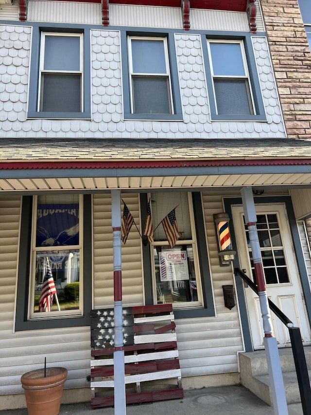 233 W Broad St, Tamaqua, PA 18252 - view of front facade featuring a porch and roof with shingles