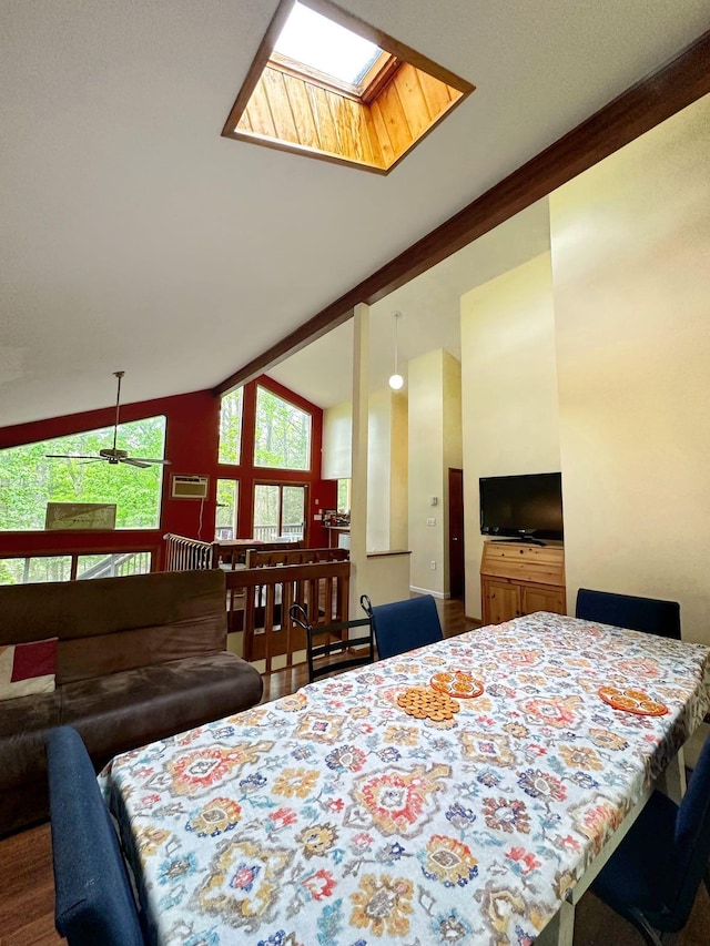 207 Manchester Dr, Bushkill, PA 18324 - dining space featuring wood finished floors, high vaulted ceiling, and a skylight