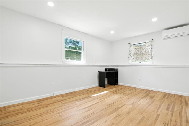 52 Bull Pine Rd, East Stroudsburg, PA 18301 - spare room with a wall unit AC, wood finished floors, and recessed lighting