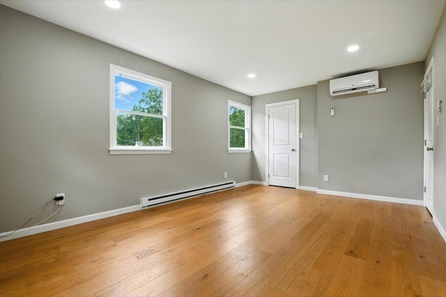 52 Bull Pine Rd, East Stroudsburg, PA 18301 - unfurnished room featuring a baseboard radiator, an AC wall unit, wood finished floors, and recessed lighting