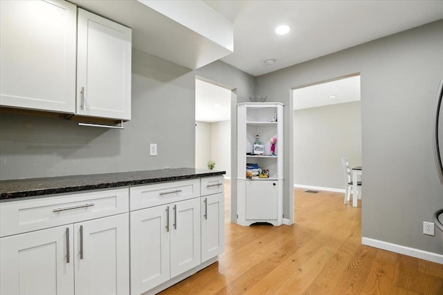 52 Bull Pine Rd, East Stroudsburg, PA 18301 - kitchen featuring white cabinetry, light wood-style flooring, dark stone countertops, recessed lighting, and open shelves