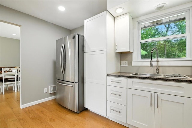52 Bull Pine Rd, East Stroudsburg, PA 18301 - kitchen featuring freestanding refrigerator, dark countertops, light wood-style floors, white cabinets, and recessed lighting