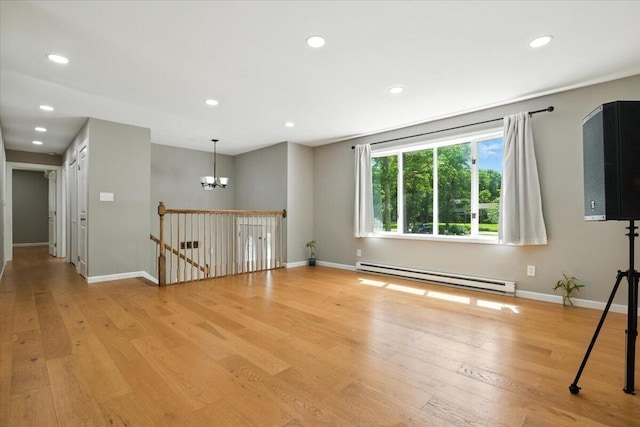 52 Bull Pine Rd, East Stroudsburg, PA 18301 - empty room with a baseboard radiator, a chandelier, light wood finished floors, and recessed lighting