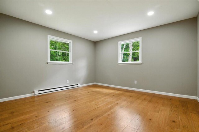 52 Bull Pine Rd, East Stroudsburg, PA 18301 - spare room with baseboard heating, light wood-type flooring, and recessed lighting
