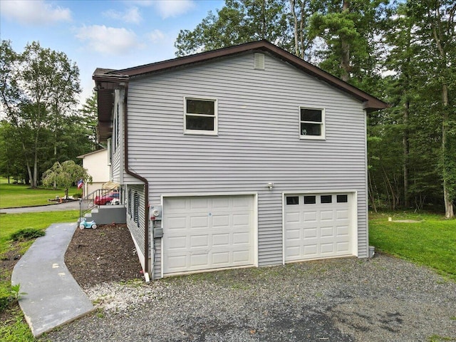 52 Bull Pine Rd, East Stroudsburg, PA 18301 - view of side of property featuring an attached garage and driveway