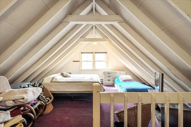 bedroom with lofted ceiling and carpet floors