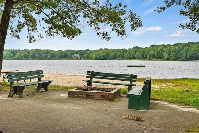 surrounding community with a view of trees and a water view