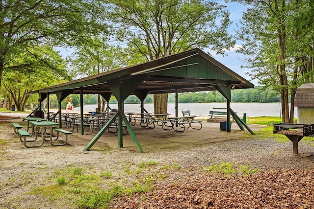 surrounding community featuring a gazebo and a water view