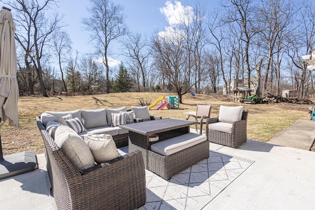 view of patio with an outdoor hangout area and a playground