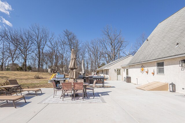 view of patio / terrace featuring area for grilling and outdoor dining area