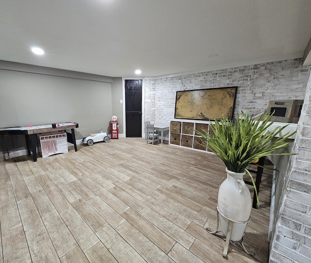 interior space featuring recessed lighting, wood finished floors, and baseboards