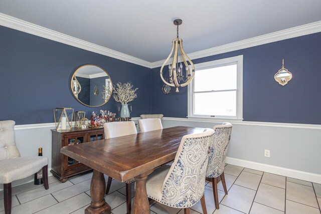 dining room with light tile patterned flooring, baseboards, and ornamental molding