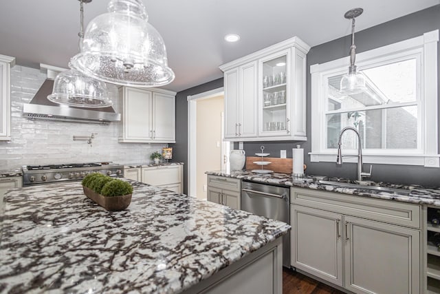 kitchen featuring dark stone countertops, glass insert cabinets, tasteful backsplash, and stove