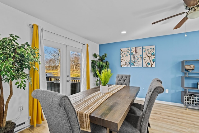 2255 Whippoorwill Dr, Tobyhanna, PA 18466 - dining area with wood finished floors, a ceiling fan, baseboards, baseboard heating, and french doors