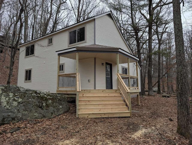 view of front of home with covered porch and stairway