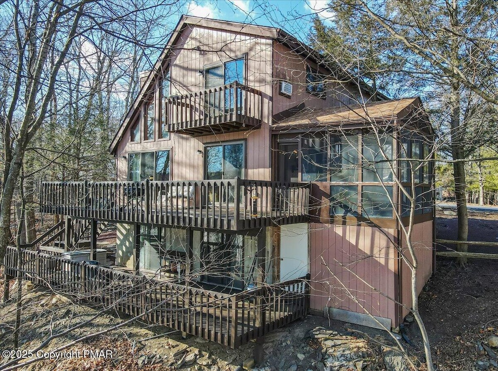 rear view of house featuring a balcony