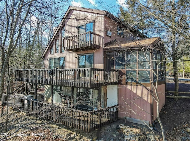 rear view of house featuring a balcony