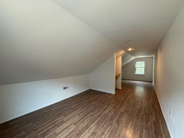 90 Packerton Dam Dr, Lehighton, PA 18235 - additional living space with dark wood-type flooring, visible vents, baseboards, and vaulted ceiling