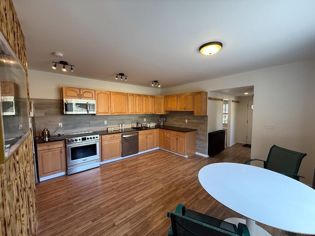 90 Packerton Dam Dr, Lehighton, PA 18235 - kitchen featuring tasteful backsplash, appliances with stainless steel finishes, dark countertops, light brown cabinetry, and dark wood finished floors