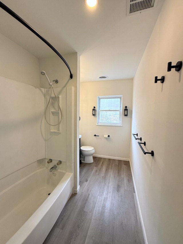 90 Packerton Dam Dr, Lehighton, PA 18235 - bathroom featuring baseboards, toilet, visible vents, tub / shower combination, and wood finished floors
