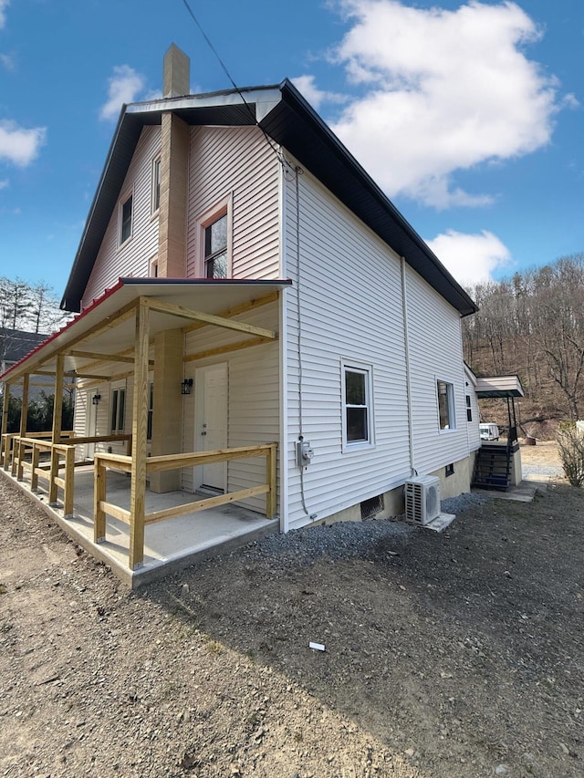 90 Packerton Dam Dr, Lehighton, PA 18235 - view of property exterior with ac unit, a patio, and a chimney