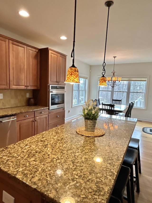 565 Ridge Rd, Bangor, PA 18013 - kitchen with stone countertops, recessed lighting, a kitchen island, stainless steel appliances, and wood finished floors