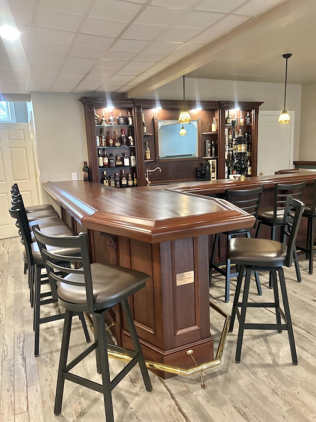 565 Ridge Rd, Bangor, PA 18013 - bar featuring bar area, decorative light fixtures, and light wood-style flooring