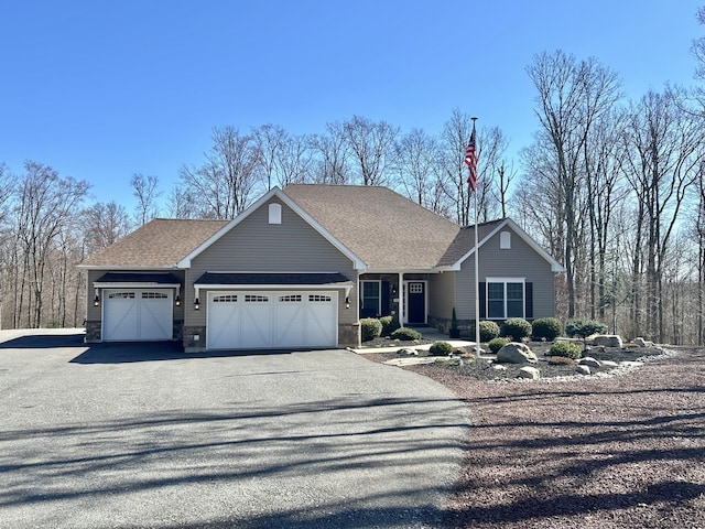 565 Ridge Rd, Bangor, PA 18013 - ranch-style house featuring an attached garage, roof with shingles, aphalt driveway, and stone siding