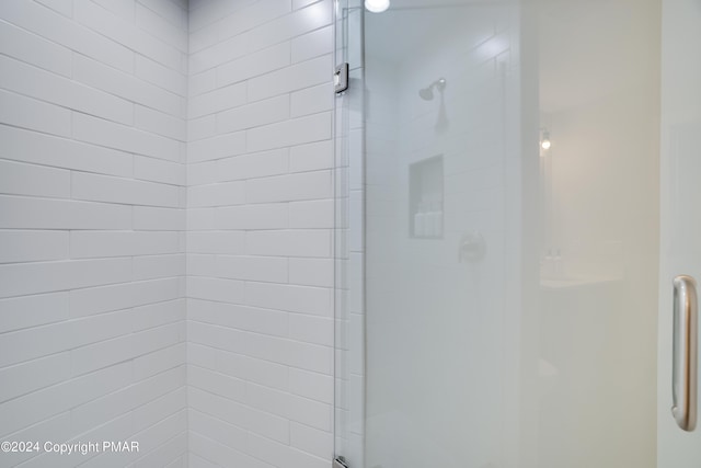 full bath featuring a shower stall