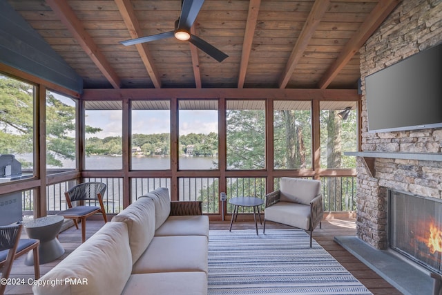 living area with wooden ceiling, vaulted ceiling with beams, and wood finished floors